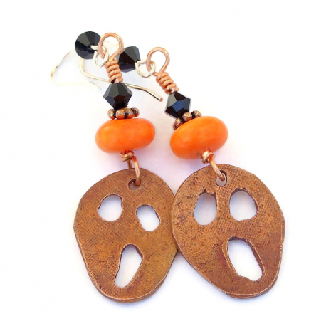 back side of copper halloween scream handmade earrings orange black