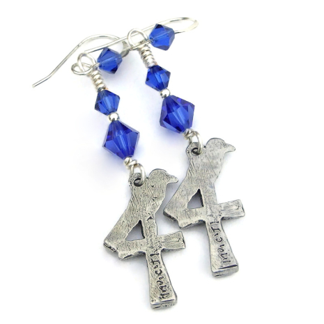 back side of crosses birds handmade earrings showing makers mark