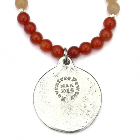 back side of the handmade dharma wheel pendant