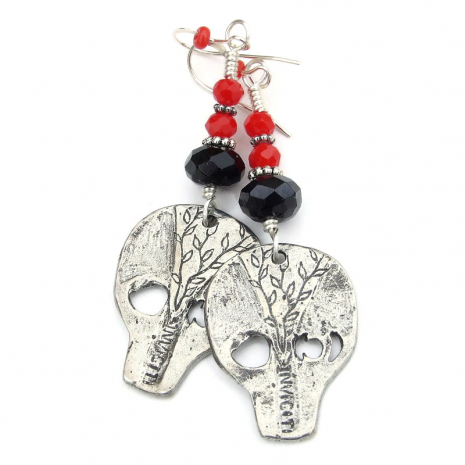 back side of goth skull halloween earrings with ivy and makers mark handmade