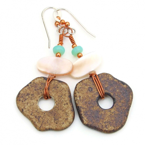 back side of petroglyph disc handmade earrings boho