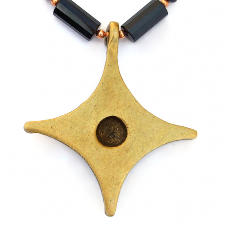 back side of vintage brass cross pendant