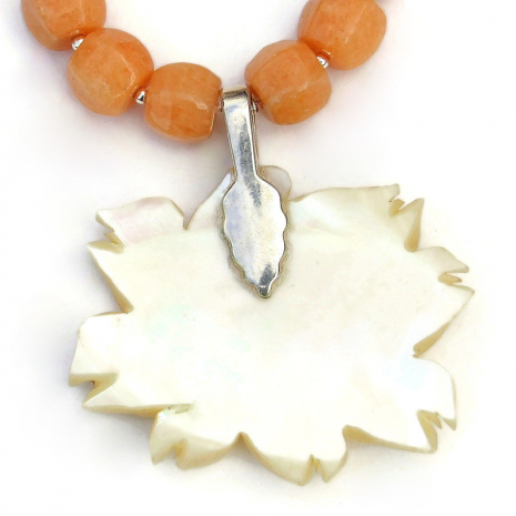 back side of vintage hand carved mother of pearl rose pendant sterling bail
