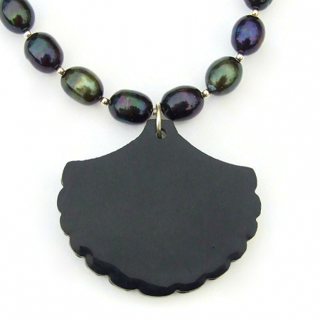 black resin back side of the paua shell pendant