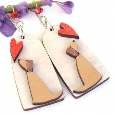 Since the dogs and hearts were laser cut and permanently glued to the background, they dogs dog hearts handmade earrings lightweight wood red Swarovski crystals