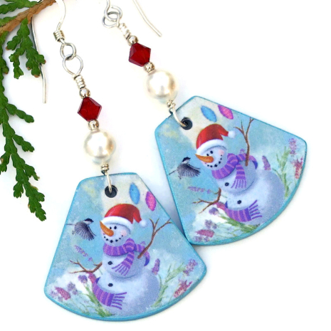 Glowing white Swarovski crystal pearls and Siam red Swarovski crystal bicones were stacked above the dangles. polymer clay christmas snowman chickadee jewelry lightweight