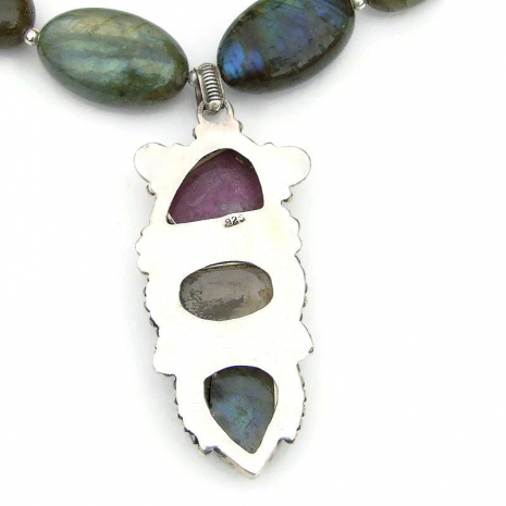 hallmarked back side of three gemstone southwest sterling pendant