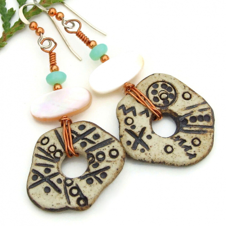 petroglyph inspired ceramic disc earrings handmade mother of pearl