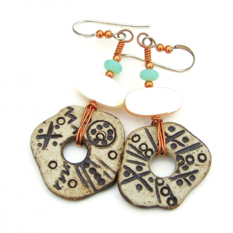 petroglyph inspired ceramic disc jewelry handmade mother of pearl