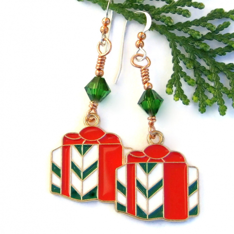 The enamel present charms have a wonderful slightly raised texture where each color of the enamel meets. red green white presents gifts handmade Christmas earrings Swarovski crystals