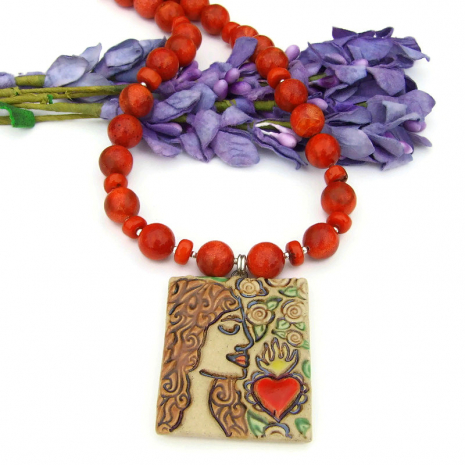 sacred heart pendant and red orange sponge coral necklace