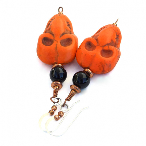 Orange skull earrings for women.
