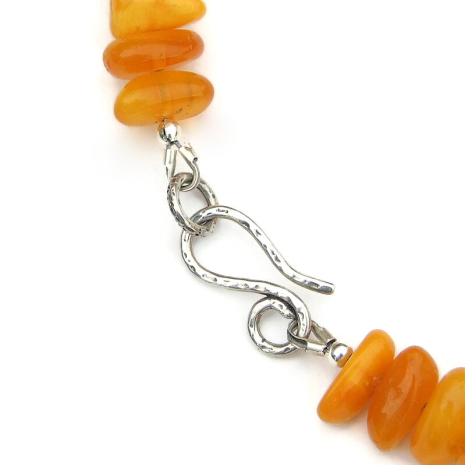 textured sterling silver hook clasp set finishes the amber necklace securely