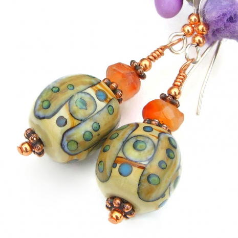 tribal symbols earrings handmade lampwork faceted carnelian