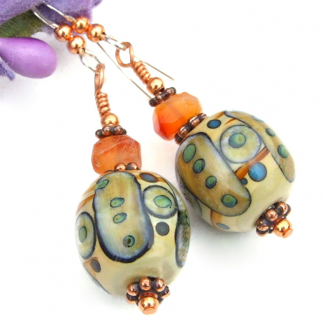 tribal symbols lampwork orange carnelian earrings beige brown green blue copper
