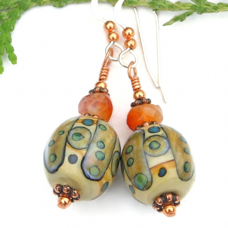 tribal symbols lampwork orange carnelian jewelry beige brown green blue copper