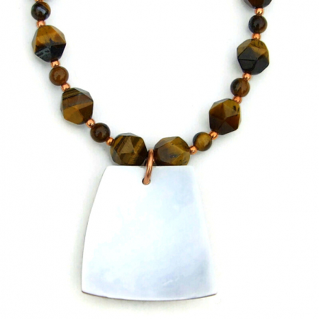 white back side of tiger cowrie shell pendant