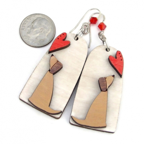 The one of a kind DOG LOVE earrings shown with a dime for size comparison. wooden dog hearts earrings handmade crystals