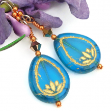 The meaningful SHANTI handmade earrings feature aquamarine blue Czech glass lotus flwoer teardrops, rose gold Swarovski crystals, copper and sterling silver - perfect jewelry for the woman who loves yoga and/or meditates. aquamarine glass lotus flower yoga earrings gold swarovski crystals handmade