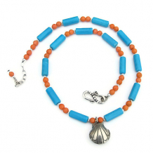 The serene Blue Waters, Coral Sands necklace features a Thai Hill Tribes fine silver seashell pendant, turquoise magnesite, coral magnesite and sterling silver - perfect jewelry for the beach babe. blue and coral beach necklace with seashell pendant