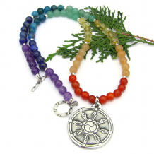 The meaningful DHARMA WHEEL handmade necklace features an artisan Britannia pewter dharma wheel pendants, gemstones in the severn chakra colors, czech glass and sterling silver - unique jewelry for women. chakra gemstone necklace dharma wheel pendant handmade