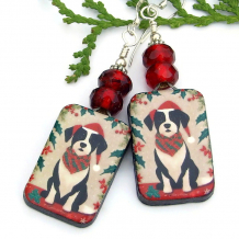 The fun CHRISTMAS DOGS handmade earrings feature artisan ceramic Santa dog dangles, red Czech glass roller beads and sterling silver - unique holiday jewelry gift for women. christmas santa dogs earrings dog lover holiday handmade jewelry