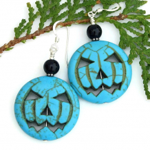 The unique TURQUOISE JACK O’ LANTERNS earrings feature carved turquoise magnesite pumpkins, black onyx and sterling silver - handmade Halloween jewelry for women. halloween jack o lantern earrings handmade gift for women