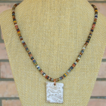 The DREAM horse pendant necklace features an artisan ceramic running horse with dream pendant and mixed gemstone heishe with copper - perfect jewelry for the horse lover. horse dream ceramic pendant necklace gift for women