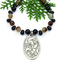 The ST. CHRISTOPHER handmade necklace features an artisan dog headed St Christopher pewter pendant, black agate, black onyx teardrops and sterling silver - unique religious jewelry for women. religious st christopher dog head pendant necklace handmade agate black onyx