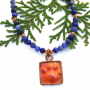 red_copper_dog_paw_print_pendant_jewelry_with_blue_sodalite.jpg